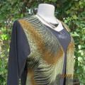All seasons black stretch polyester long sleeves slip over top with green/gold waistcoat fronts.38.