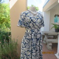 Stunning ankle length empire top steel blue/white poly/nylon dress.Side straps.Bell sleeves. Size 36