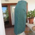 Smart dark green bottle green fully lined pencil size 36 skirt. With pleat and zip at back. As new.