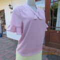 Pretty baby pink sheer poly top with double front.V front with neck foldover.Size 33.By CTNU.As new