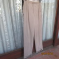 High quality PRO SPIRIT size 28 men`s trousers in sand colour poly/viscose blend. Pleats on front.