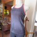 Pretty sport stretch poly sleeveless black/grey with polkadots and crimson edging .Size 32/34