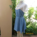 Cute light blue denim short dress with cream stretch lace neckline area and short sleeves. Size 35.