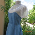 Cute light blue denim short dress with cream stretch lace neckline area and short sleeves. Size 35.
