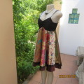 Pretty flare colourful bo-ho patterned empire dress with black strappy bodice. By JESSICA size 34/10