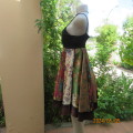 Pretty flare colourful bo-ho patterned empire dress with black strappy bodice. By JESSICA size 34/10