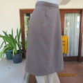 Elegant light brown polycotton boutique made pencil skirt. Size 42/18. Pleat and zip at back.New con