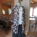 Get noticed in this black sheer stretch polyester extra long jacket/crimson flowers.Size 34.New item