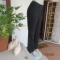 As new black polyester ELEMENTS straight legged pants with side slits. Size 38/14. With belt loops.