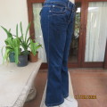As new modern blue denim flare jeans in size 38/14. Pockets back/front. Med. rise. As new condition.