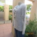 Warm fluffy silver grey polyester knit long sleeve sweater by KELSO size 36/12. In new condition.