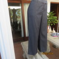 Smart grey pinstripe ankle length wide legged poly/rayon blend pants. By WOOLWORTHS size 38.New cond