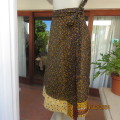Stunning reversible wrap around skirt in raw silk and sheer polyester. Size 36 to 38. As new