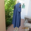 Cute light weight blue denim naked shoulder dress with asymmetrical seamline. Size 42 by MILADYS.