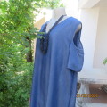 Cute light weight blue denim naked shoulder dress with asymmetrical seamline. Size 42 by MILADYS.