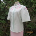 Amazing mint green silk blouse with short sleeves . Hidden button down.Luxe embroidery.By BONITA 35.