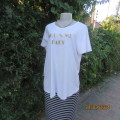 Cute white maternity T Shirt with short sleeves. Logo...YOU AND ME BABY...in gold. Size 40. As new
