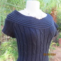 Chunky acrylic knit black cable pattern dress. Tiny sleeves/stunning wide neckline.Size 34. New cond