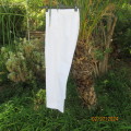 New white poly/viscose pants by FG Uniforms 2008. Size 34... 87cm/74RS. Pleats on front.Side pockets