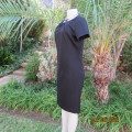 Very black richly embellished polyester vintage dress by `COVERGIRL` size 38. Long back zip. As new.