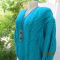 Chunky hand knitted caribbean turquoise pullover cardigan. Knit on long sleeves. Size 40/16.As new