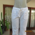 Totally on trend ivory linen/cotton blend straight legged pants Zip and drawstring waist. By NEWS 34