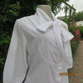Chic white cotton top with bow collar and hidden button down front.Elbow sleeves. Size 38.As new.