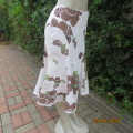 Chic linen/cotton blend white unique paneled gored skirt with brown/green flowers. Size 36.