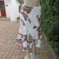 Chic linen/cotton blend white unique paneled gored skirt with brown/green flowers. Size 36.
