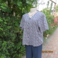 Soft cool short sleeve V neck top in dark steel blue with tiny blue/crimson flowers. Size 42.