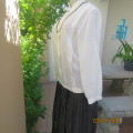 Optic white long sleeve button down top. Two wide tucked seams. Polyester. Chinese collar.Size 38
