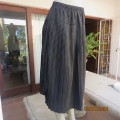 Easy wear black yoked knife pleated silky polyester skirt with white polka dots.Size 42. WOOLWORTHS