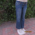 Pair of blue denim cotton Slouch fit low rise jeans by ST BERNARD size 34.Bootlegged. Very good cond