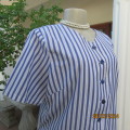 Comfy vertical striped short sleeve top in white/blues. Button down/V neckline.Size 40 by LYNETTE.
