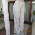 Cargo pants in buttermilk beige. 100% cotton. By REAL Clothing size 38. Drawstring waist.New cond