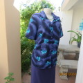 Silky polyester navy short sleeve top with blue/turquoise leaves. Size 36.Small V with collar.As new