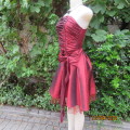 Chic garnet red polyester satin strappy dress. Ruched top front. Skater skirt. Size 36.Brand new con