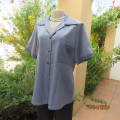Boutique made short sleeve button down top/jacket in blues. Polyester/viscose. Size 38. One pocket.