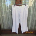 As new snow white size 44/20 straight legged pants in polyester stretch. Front pockets. Inner leg 70