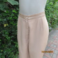 Glamour satin polyester rich cream pants. Tapered legs. Size 38/14. No pockets. Flat front. New cond