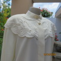 Amazing rich cream silky poly long sleeve blouse. Overhanging round embroidered front yokes.Size 40