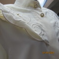 Amazing rich cream silky poly long sleeve blouse. Overhanging round embroidered front yokes.Size 40