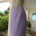 Elegant lavender lined pencil skirt size 42. Elasticated waistband sides. Brand new condition.