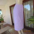 Elegant lavender lined pencil skirt size 42. Elasticated waistband sides. Brand new condition.