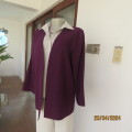 Power jacket in purple with rounded V fronts open hanging. Polycotton. Size 40. Boutique made.As new