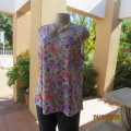 Sleeveless floral slip over 100% polyester top in pinks and lilac. Size 40 by IMAGE. As new cond.
