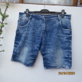 Men`s blue denim worn jean shorts in size 38. Pockets back/front. By LKA Australia. Good condition.