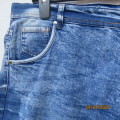 Men`s blue denim worn jean shorts in size 38. Pockets back/front. By LKA Australia. Good condition.