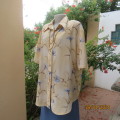 Tastefully printed rich cream/blue floral short sleeve Boutique made top. Size 44. New cond.