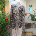 Animal print long sleeve winters top in stretch polyester size 46/22. Drawstring right front. As new